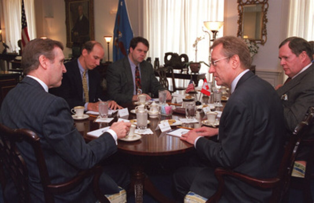 Secretary of Defense William Cohen (left) meets with his Canadian counterpart Arthur Eggleton (2nd from right) at the Pentagon, April 10, 1999, to discuss the progress of Operation Allied Force -- the NATO bombing campaign against Yugoslavia. Among those attending the meeting are: James Bodner (2nd from left) principal deputy under secretary of defense for policy; Robert Tyrer (center), Cohen's chief of staff, and Raymond A.J. Chretien (right) the Canadian ambassador to the United States. 