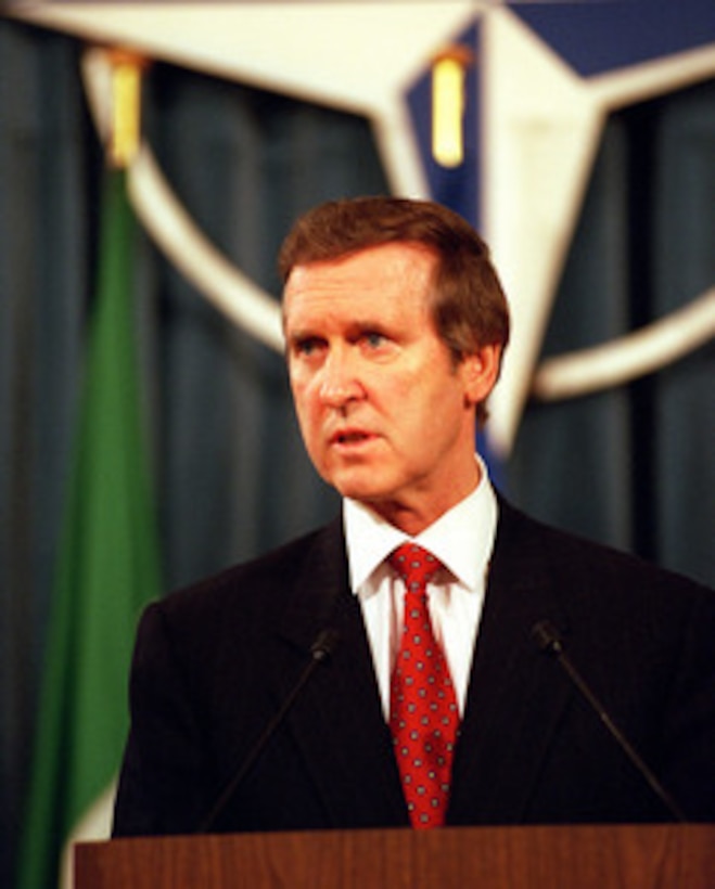 Secretary of Defense William S. Cohen conducts a press briefing at NATO Headquarters, Brussels, Belgium, on April 7, 1999. Cohen is in Belgium to meet with Supreme Allied Commander Europe Gen. Wesley K. Clark, U.S. Army, and to attend the North Atlantic Council meeting. 