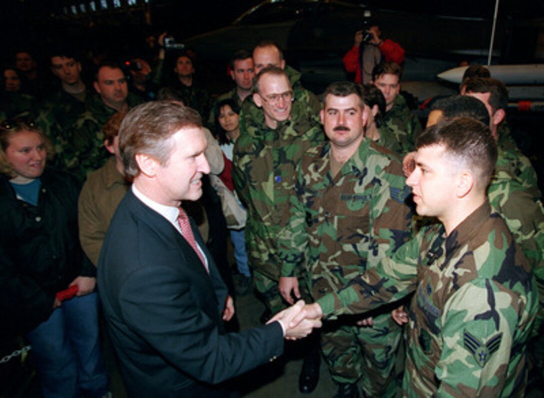 Secretary of Defense William S. Cohen mingles among the airmen and their families that gathered to hear him at Aviano Air Base, Italy, April 8, 1999. Italian Defense Minister Carlo Scognamiglio and Vice Chairman of the Joint Chiefs of Staff Gen. Joseph W. Ralston, U.S. Air Force, also addressed the approximately 200 pilots, aircrew and support personnel involved in NATO Operation Allied Force at Aviano. 
