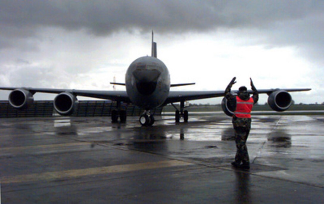 A U.S. Air Force KC-135 Stratotanker is marshaled to a parking spot at RAF Fairford, United Kingdom on April 12, 1999. The Stratotanker has been deployed from Mountain Home Air Force Base, Idaho, to support refueling missions during NATO Operation Allied Force. Operation Allied Force is the air operation against targets in the Federal Republic of Yugoslavia. 