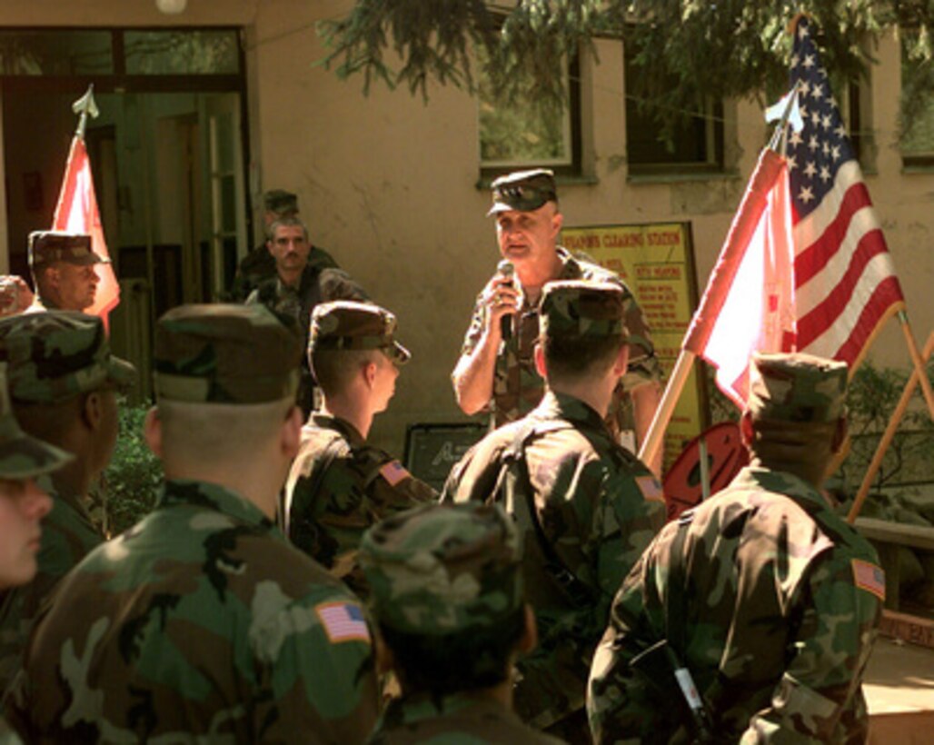 Chairman of the Joint Chiefs of Staff Gen. Henry H. Shelton, U.S. Army, speaks to soldiers of the 13th Signal Battalion during his visit to Eagle Base in Tuzla, Bosnia and Herzegovina, on July 15 1999. Shelton is visiting U.S. troops deployed throughout Europe. The 13th Signal Battalion is deployed from Fort Hood, Texas, on a peacekeeping mission in Bosnia and Herzegovina in support of Operation Joint Forge. 