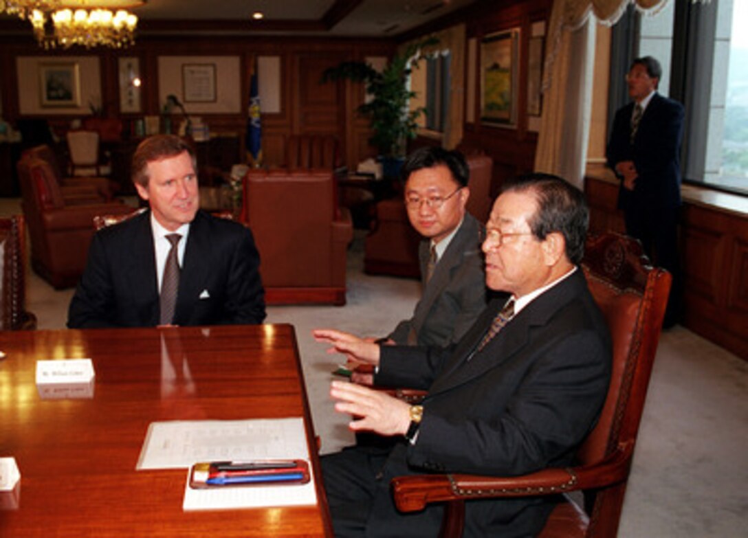 Secretary of Defense William S. Cohen (left) meets with South Korean Prime Minister Kim Chong Pil (right) at the Ministry of Foreign Affairs in Seoul on July 29, 1999. Cohen is in South Korea to meet with leaders and U.S. troops stationed there. 