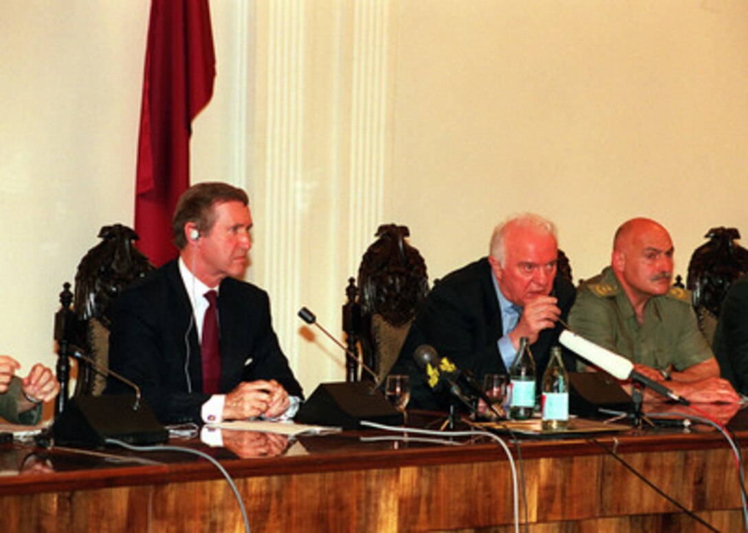 Secretary of Defense William S. Cohen (left) and Georgian President Eduard Shevardnadze (center) conduct a joint press briefing as Minister of Defense David Tevzadze (right) listens at Krtsanisi, the presidential compound near Tbilisi, Georgia, on Aug. 1, 1999. 