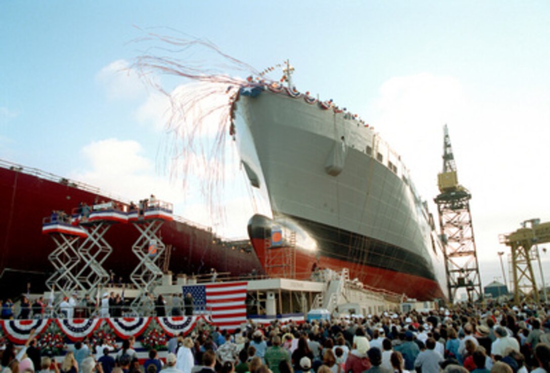 The USNS Red Cloud (T-AKR 313) slides down the ways at NASSCO Ship Yard in San Diego, Calif., after being christened by Anita Red Cloud and Marilyn Clemins on Aug. 7, 1999. The ship is named after Medal of Honor winner Cpl. Mitchell Red Cloud Jr., U.S. Army. The 950 foot long, medium speed, roll-on/roll-off ship is one of 20 Military Sealift Command ships under construction. Red Cloud is the daughter of the ship's name sake. Clemins is the wife of Commander in Chief, U.S. Pacific Fleet Adm. Archie R. Clemins, U.S. Navy. 