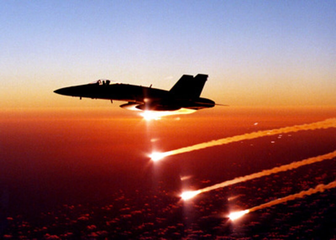 U.S. Navy pilot Lt. Reggie Hamon expends flares from his F/A-18C Hornet over the Pacific Ocean during a competitive training exercise on Aug. 16, 1999. Hamon, from Strike Fighter Squadron 146 of Naval Air Station Lemoore, Calif., is deployed aboard the aircraft carrier USS John C. Stennis (CVN 74). The Stennis and its embarked Carrier Air Wing 9 are going through the training exercise in preparation for their next deployment. 