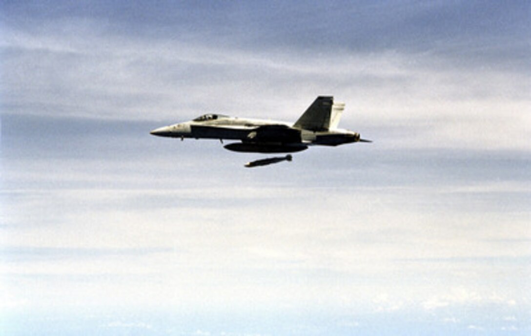A U.S. Navy F/A-18C Hornet releases a Joint Direct Attack Munitions (JDAM) in the first fleet squadron drop of the newly developed weapon during training at the Okinawa, Japan Range Area on Aug. 22, 1999. JDAM uses a global positioning system aided inertial navigation system to guide its 2,000 or 1,000 pound warhead to the target with a high degree of accuracy. The Hornet, attached to Strike Fighter Squadron 195 of Naval Station Yokosuka, Japan, is operating from the flight deck of the aircraft carrier USS Kitty Hawk (CV 63). 