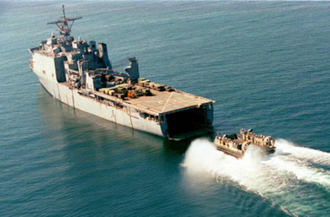 A Landing Craft Air Cushion prepares to enter the well deck of the USS Gunston Hall (LSD 44) as the ship lies at anchor in the Gulf of Izmit off the coast of Turkey on Aug. 29, 1999. The Kearsarge Amphibious Readiness Group and the 26th Marine Expeditionary Unit are in Turkey to aid victims of the recent earthquake as part of Operation Avid Response. Avid Response is the U.S. military contribution to relief efforts following the earthquake that hit Western Turkey in the early morning hours of Aug. 17, 1999. The landing craft, more commonly called an LCAC, is shuttling vehicles and supplies for use by Marines and sailors ashore at Hersek, Turkey. 