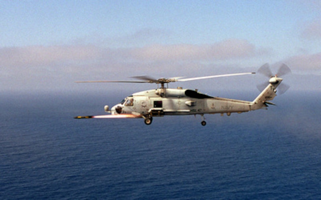 An AGM-114B Hellfire missile roars off the rails of a U.S. Navy SH-60 Seahawk helicopter toward a laser designated surface target during training off the coast of San Clemente Island, Calif., on Aug. 25, 1999. The Seahawk is attached to Light Helicopter Anti-Submarine Squadron 47 at Naval Air Station North Island, San Diego, Calif. 