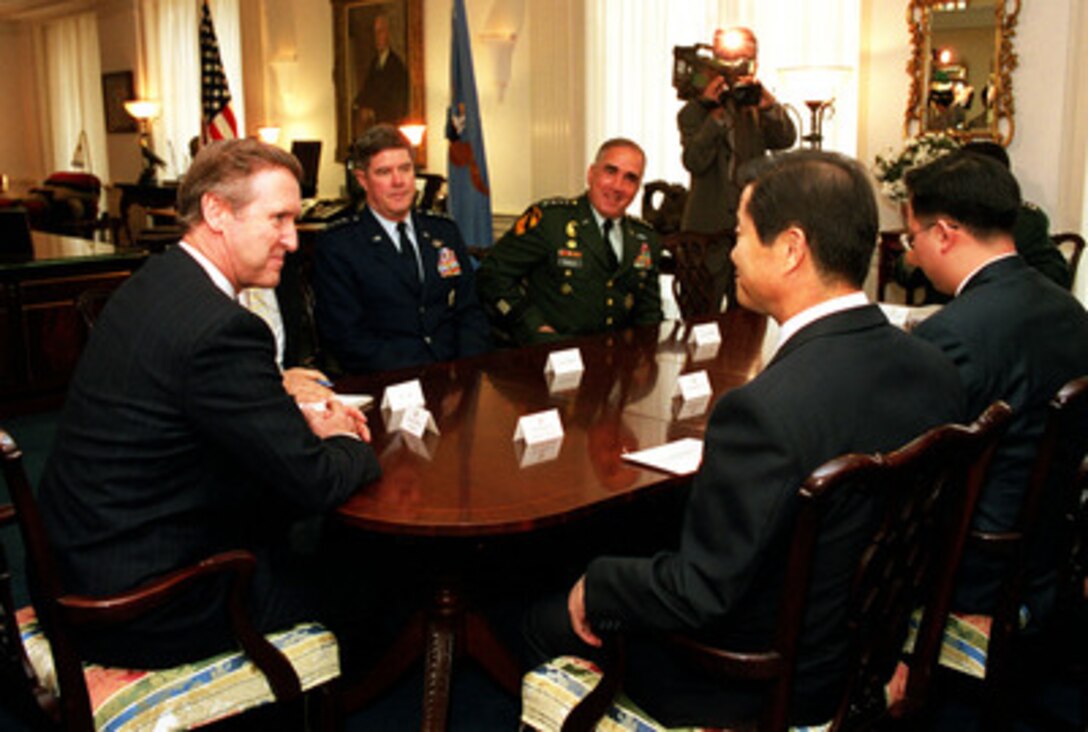 Secretary of Defense William S. Cohen (left) meets with South Korean Minister of National Defense Cho Song-tae (2nd from right) in Cohen's Pentagon office on Nov. 23, 1999. Cohen and Cho are meeting briefly before starting the 31st Annual U.S.-Republic of Korea Security Consultative Meeting where they will discuss issues relating to the peace and security of the Korean Peninsula. Vice Chairman of the Joint Chiefs of Staff Gen. Joseph Ralston (2nd from left), U.S. Air Force and Commander in Chief of the United Nations Command and the Combined Forces Command Gen. John H. Tilelli Jr. (3rd from left), U.S. Army, joined Cohen, Cho and their counterparts in the meeting. Minister Cho's interpreter Lt. Lee Jae-myong is at the far right. 