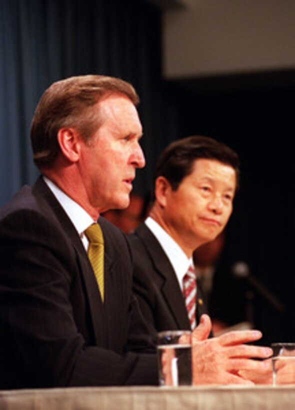 Secretary of Defense William Cohen (left) responds to a reporter's question during a joint Pentagon press conference with Republic of Korea Minister of National Defense Cho Song-Tae (right) on Nov. 23, 1999. The conference was held at the conclusion of the 31st Annual U.S.-Republic of Korea Security Consultative Meeting. 