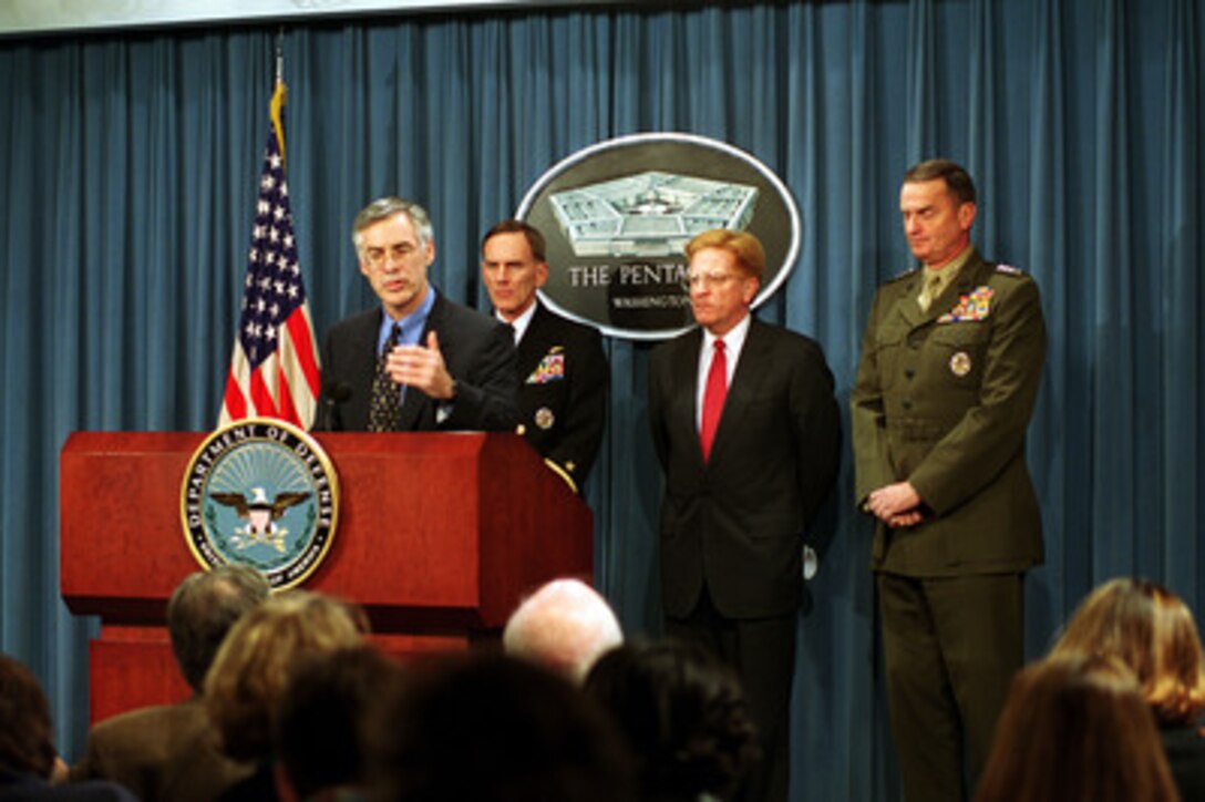 Secretary of the Navy Richard Danzig responds to a reporter's question during a Pentagon briefing concerning the use of the training range on Vieques, Puerto Rico, on Dec. 3, 1999. Behind Danzig is from left to right: Chief of Naval Operations Adm. Jay Johnson; Under Secretary of Defense for Personnel and Readiness Rudy de Leon; and Commandant of the Marine Corps Gen. James Jones. 