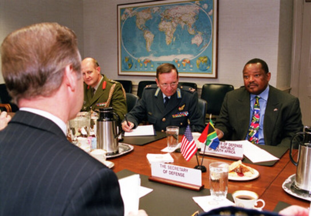 South African Defense Minister Patrick Lekota (right) meets with Secretary of Defense William Cohen (left) at the Pentagon on Dec. 7, 1999. Lakota and Cohen are having a plenary session with delegations from both nations to discuss a range of regional and global security issues. Attending the meeting as part of the South African delegation are: Col. Christaan Gildenhuys (left, far side of the table), the defense attaché at the South African Embassy, and Major General Kenneth Snowball (center), the chief of staff. 