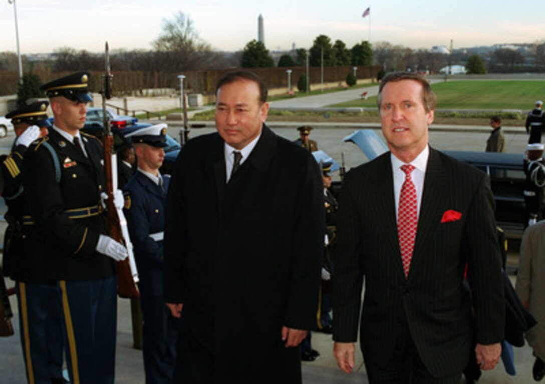 Secretary of Defense William S. Cohen (right) escorts the Minister of Defense of Kazakhstan Lt. Gen. Sat Tokpakbayev (left) into the River Entrance of the Pentagon on Dec. 17, 1999. The two defense leaders will meet to discuss a range of bilateral security issues. 