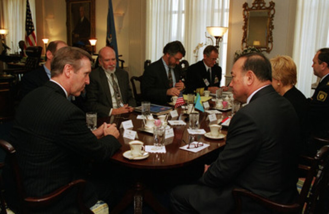 Secretary of Defense William S. Cohen (left) meets in his Pentagon office with the Minister of Defense of Kazakhstan Lt. Gen. Sat Takpakbayev (right) on Dec. 17, 1999. The two defense leaders and their staffs are meeting to discuss a range of bilateral security issues. 