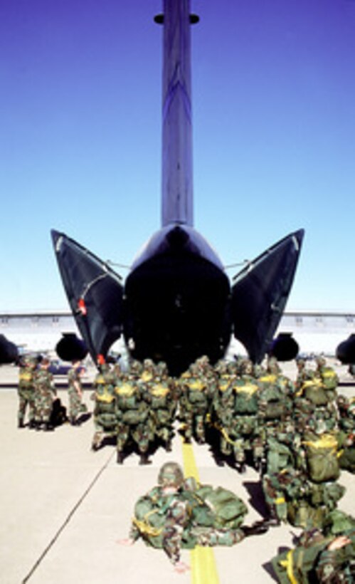 Soldiers of the U.S. Army's 82nd Airborne wait to load into a U.S. Air Force C-141 Starlifter at Pope Air Force Base, N.C., on Jan. 20, 1999. The soldiers are participating in Large Package Week, a joint exercise involving Air Force aircraft operating from Pope and soldiers of the U.S. Army's 82nd Airborne, at Fort Bragg, N.C. 