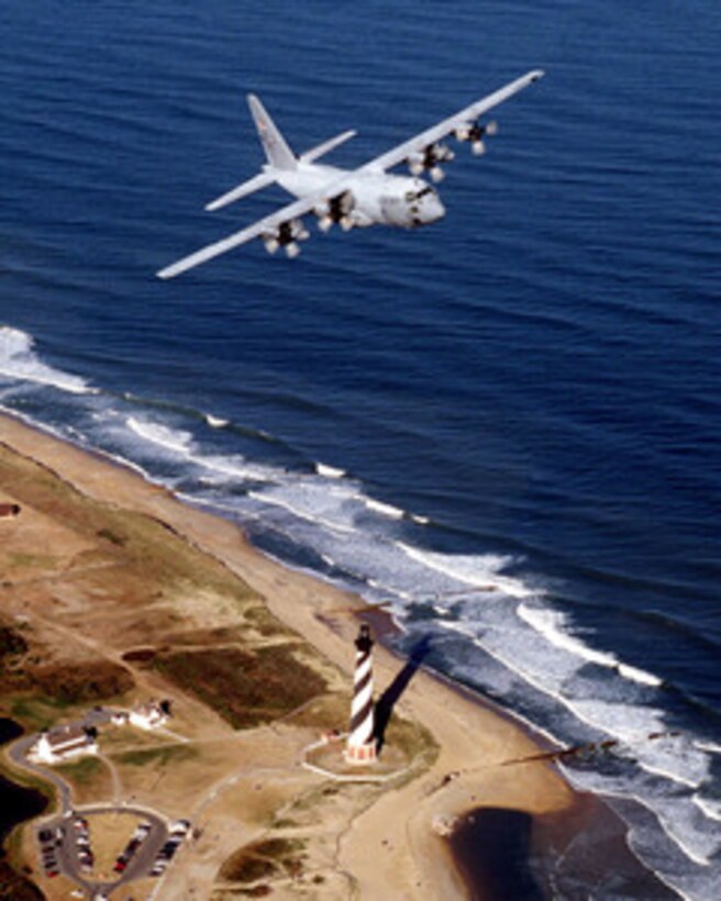 A U.S. Air Force C-130E Hercules flies over the Cape Hatteras Lighthouse on the North Carolina coast on Jan. 1, 1999. The Hercules is the Air Force's main transport for intratheater airlift. Capable of operating from rough, dirt, landing strips, the aircraft is the prime transport for dropping paratroops and equipment into hostile or remote areas. This Hercules is attached to the 2nd Airlift Squadron, Pope Air Force Base, N.C. 