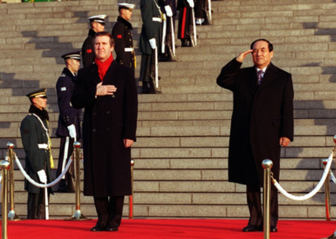 Secretary of Defense William S. Cohen (left) holds his hand over his heart for the national anthem as he is welcomed by Chun Yong-taek (right), Republic of Korea minister of national defense, with a full honors military ceremony at the Korean War Memorial in Seoul, Republic of Korea, on Jan. 15, 1999. Cohen is in Seoul to attend the 30th Annual U.S.-Republic of Korea Security Consultative Meeting. Seoul is one of the stops on Cohen's five-day trip to Japan and the Republic of Korea. 