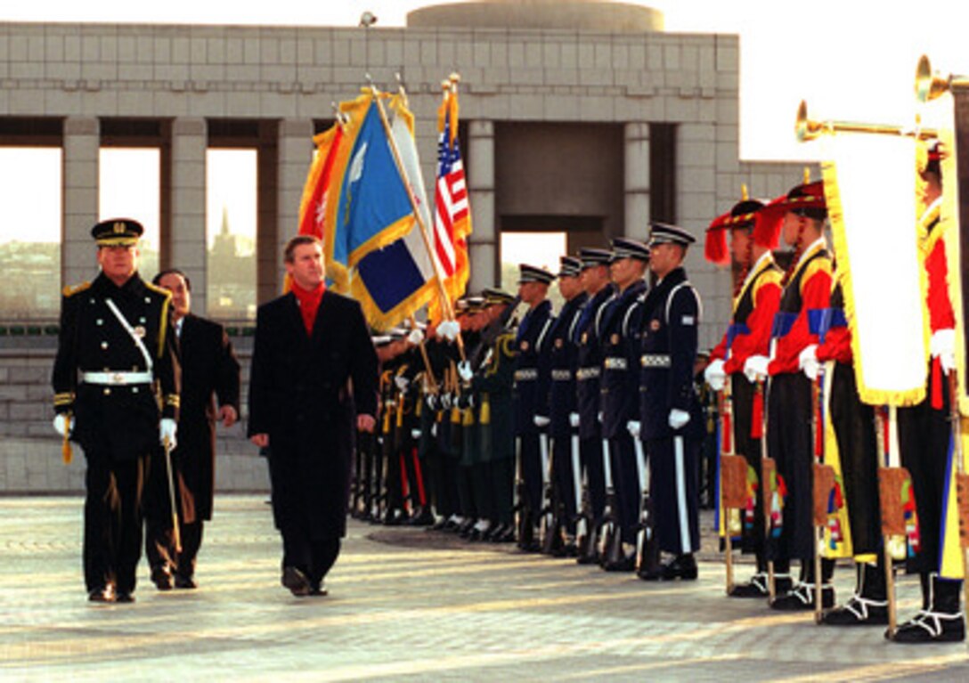 Secretary of Defense William S. Cohen (right) inspects the troops as he is welcomed by Chun Yong-taek (center), Republic of Korea minister of national defense, with a full honors military ceremony at the Korean War Memorial in Seoul, Republic of Korea, on Jan. 15, 1999. Cohen is in Seoul to attend the 30th Annual U.S.-Republic of Korea Security Consultative Meeting. Seoul is one of the stops on Cohen's five-day trip to Japan and the Republic of Korea. 
