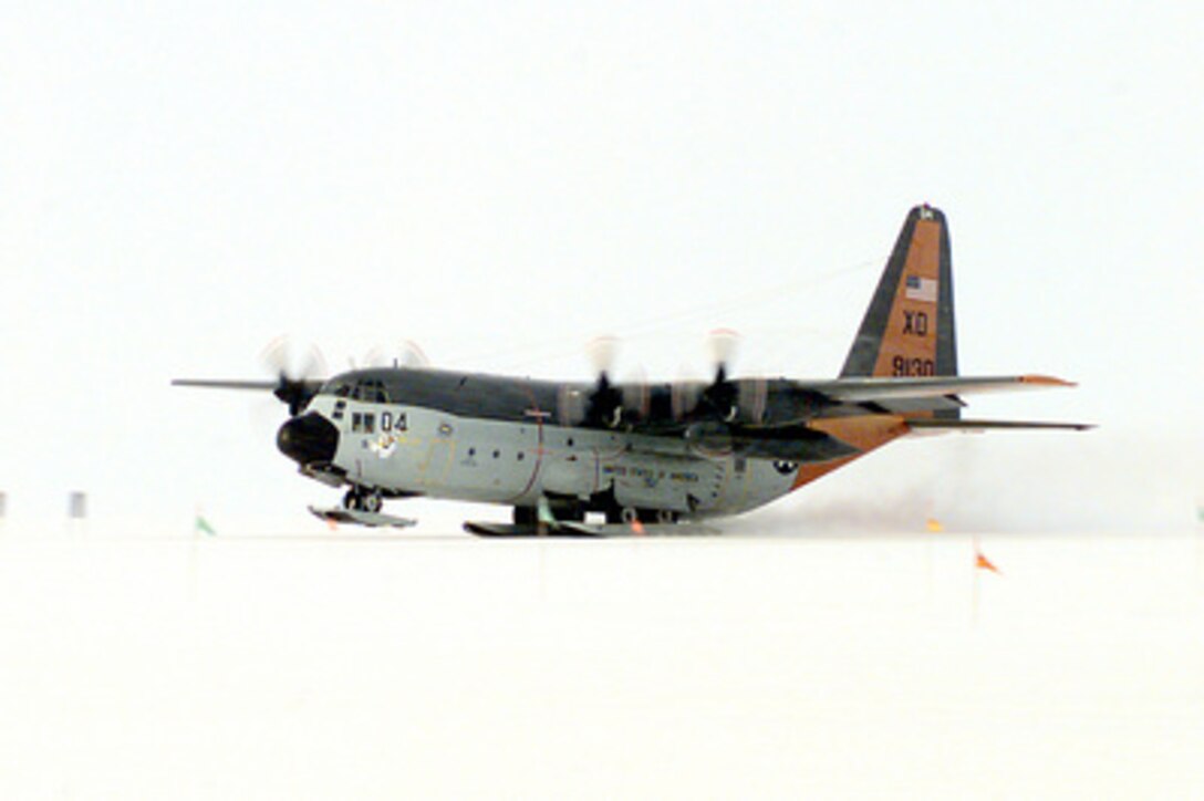 A U.S. Navy C-130 Hercules from Antarctic Development Squadron 6 makes the squadron's final departure from the snow-packed runway of Williams Field, Antarctica, on Feb. 17, 1999. The Antarctic Development Squadron, more commonly known as VXE-6, has supported Operation Deep Freeze for over 44 years. The mission is being taken over by U. S. Air Force aircraft from McChord Air Force Base, Wash. 