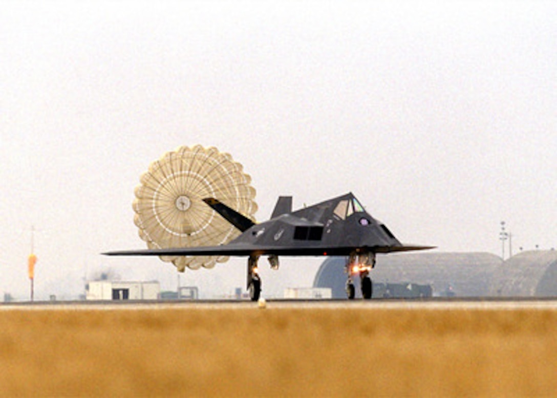 An F-117 Nighthawk uses a parachute to help it slow down after landing at Aviano Air Base, Italy, on Feb. 21, 1999. U.S.-based aircraft and support personnel are deploying to their forward staging bases in Europe for potential NATO air operations. The U.S. Air Force stealth fighter is deployed from the 8th Fighter Squadron, Holloman Air Force Base, N.M. 