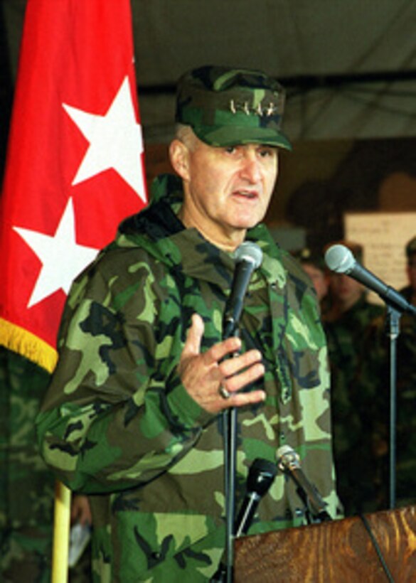 Gen. Henry H. Shelton, chairman of the Joint Chiefs of Staff, answers a reporter's question as he holds a press conference at Comanche Base in Bosnia and Herzegovina on Dec. 22, 1998. Shelton is visiting with troops deployed to Bosnia and Herzegovina in support of Operation Joint Forge. 