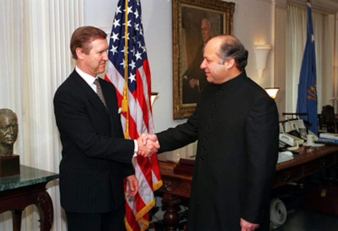 Secretary of Defense William S. Cohen (left) welcomes Prime Minister Nawaz Sharif, of Pakistan, to the Pentagon, Dec. 3, 1998. Cohen and his senior advisors will meet with Sharif to discuss a range of regional and international issues of interest to both nations. 