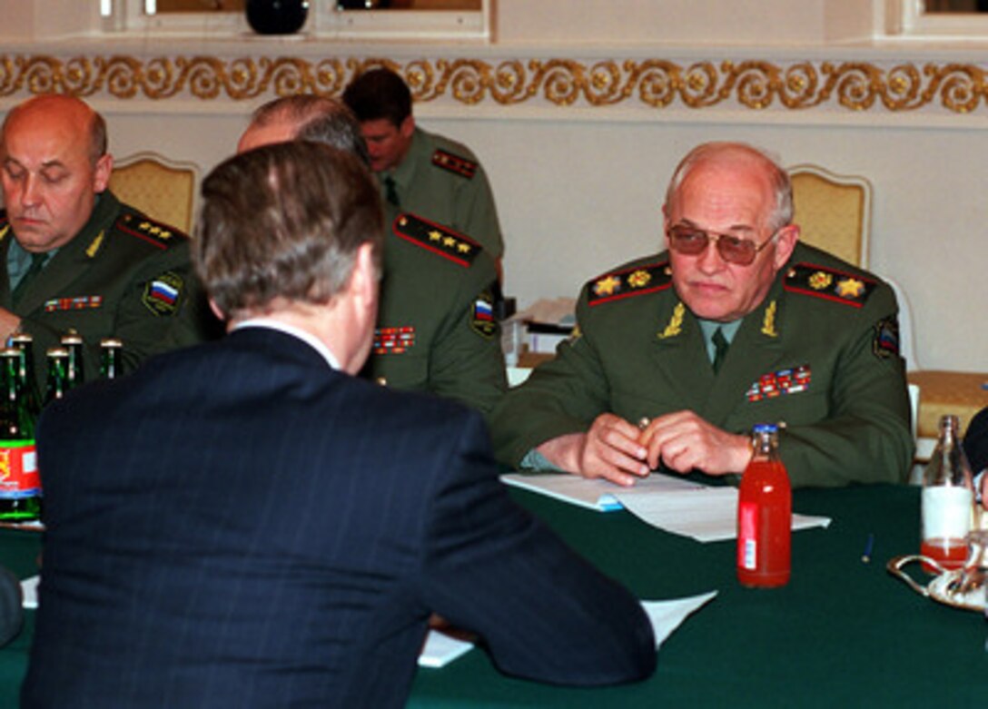 Russian Minister of Defense Marshal Igor Sergeyev (right) listens to Secretary of Defense William S. Cohen (foreground) during talks at the Presidential Place in Helsinki, Finland, on June 16, 1999. Cohen and Sergeyev are discussing the details of Russia's participation in the peacekeeping efforts in Kosovo. 