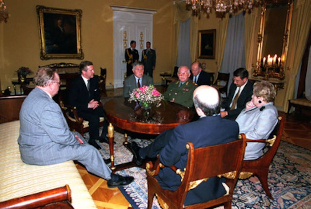 Finnish President Martti Ahtisaari (left), Secretary of Defense William S. Cohen (2nd from left), Russian Minister of Defense Marshal Igor Sergeyev (in uniform), Secretary of State Madeleine Albright (right) and Russian Minister of Foreign Affairs Igor Ivanov are joined by interpreters at the Presidential Place in Helsinki, Finland, on June 18, 1999, as they meet for further talks on Russia's participation in the peacekeeping efforts in Kosovo at the Presidential Place in Helsinki, Finland. 