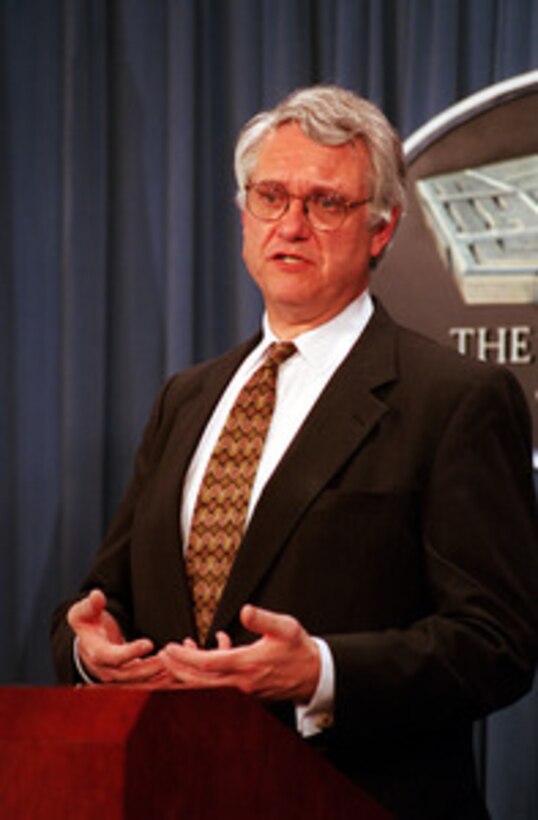 Deputy Secretary of Defense John J. Hamre answers a question at a July 8, 1999, Pentagon press briefing on the after action review process of the U.S. participation in NATO Operation Allied Force. Secretary of Defense William S. Cohen ordered the review to assess lessons learned from this operation. 