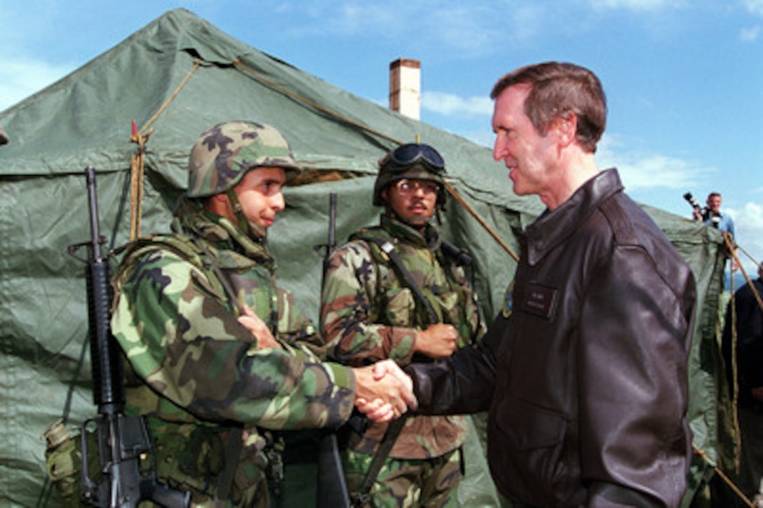 Secretary of Defense William S. Cohen (right) shakes hands with U.S. Marines of the 26th Marine Expeditionary Unit at Camp Montieth near Gnjilane, Kosovo, on June 19, 1999. Elements of the 26th Marine Expeditionary Unit have deployed from ships of the USS Kearsarge Amphibious Ready Group as an enabling force for KFOR. KFOR is the NATO-led, international military force in Kosovo conducting the peacekeeping mission known as Operation Joint Guardian. 
