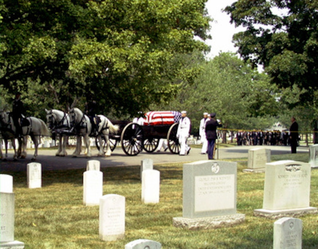 The flag-draped coffin containing the remains of NASA Astronaut and retired Navy Capt. Charles "Pete" Conrad Jr. is carried by a horse-drawn caisson to his final resting place at Arlington National Cemetery on July 19, 1999. Conrad was the spacecraft commander of the Apollo 12 mission which was the second manned moon landing and a veteran of three other space flights. 