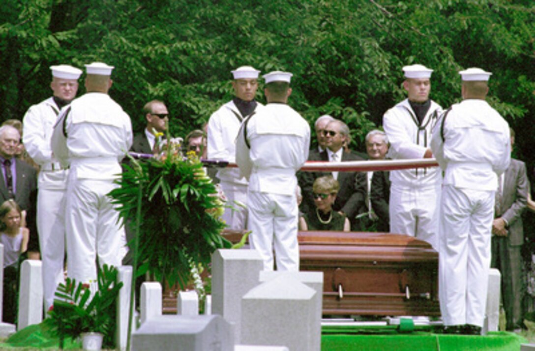 Members of the U.S. Navy Ceremonial Guard fold the flag that covered the coffin of NASA Astronaut and retired Navy Capt. Charles "Pete" Conrad Jr. during ceremonies at Arlington National Cemetery on July 19, 1999. Conrad was the spacecraft commander of the Apollo 12 mission which was the second manned moon landing and a veteran of three other space flights. 