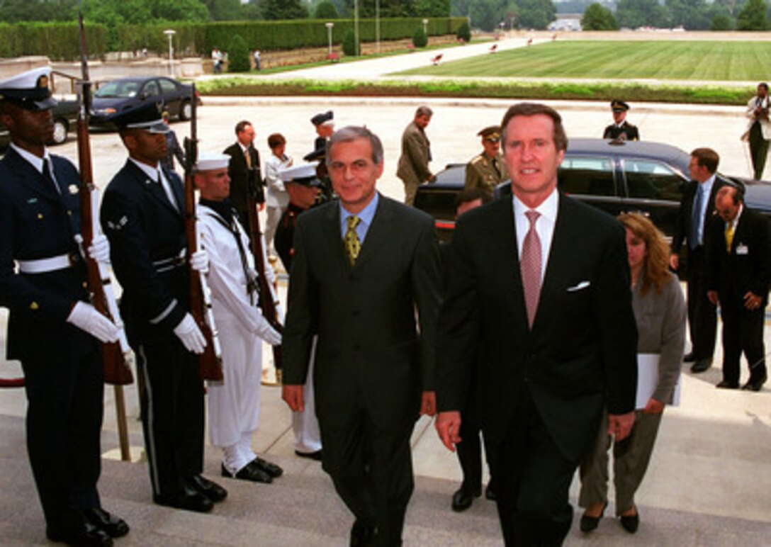 Bulgarian Minister of Defense Georgi Ananiev (left) arrives at the Pentagon on July 20, 1999, for meetings with Secretary of Defense William Cohen (right). Ananiev and Cohen will meet to discuss defense issues of interest to both nations. 