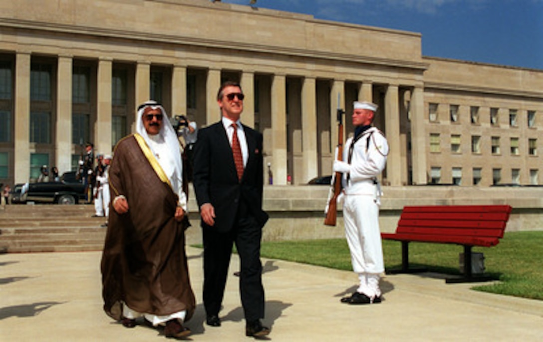 Secretary of Defense William S. Cohen (right) escorts Minister of Defense Shaykh Salim al-Sabah al-Salim Al Sabah (left), of the State of Kuwait to the parade field for an armed forces full honors ceremony welcoming him to the Pentagon on June 2, 1999. 