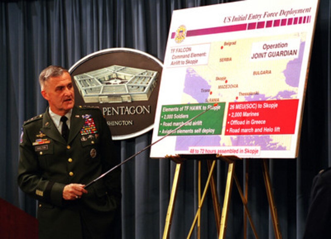 Gen. Henry H. Shelton, U.S. Army, chairman of the Joint Chiefs of Staff, briefs reporters at the Pentagon, June 10, 1999, on the plan for introducing U.S. military peace keeping forces into the Kosovo region. 