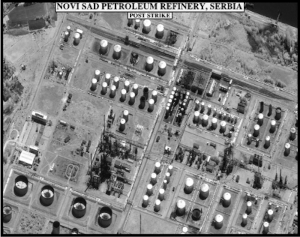 Post-strike bomb damage assessment photograph of the Novi Sad petroleum refinery, Serbia, used by Joint Staff Vice Director for Strategic Plans and Policy Maj. Gen. Charles F. Wald, U.S. Air Force, during a press briefing on NATO Operation Allied Force in the Pentagon on May 1, 1999. (Released)