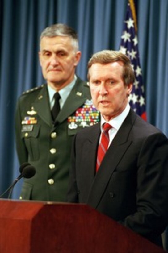 Secretary of Defense William S. Cohen (right) answers a reporter's question during a Pentagon press briefing with Chairman of the Joint Chiefs of Staff Gen. Henry H. Shelton (left), U.S. Army, on NATO Operation Allied Force on April 29, 1999. Operation Allied Force is the air operation against targets in the Federal Republic of Yugoslavia. 