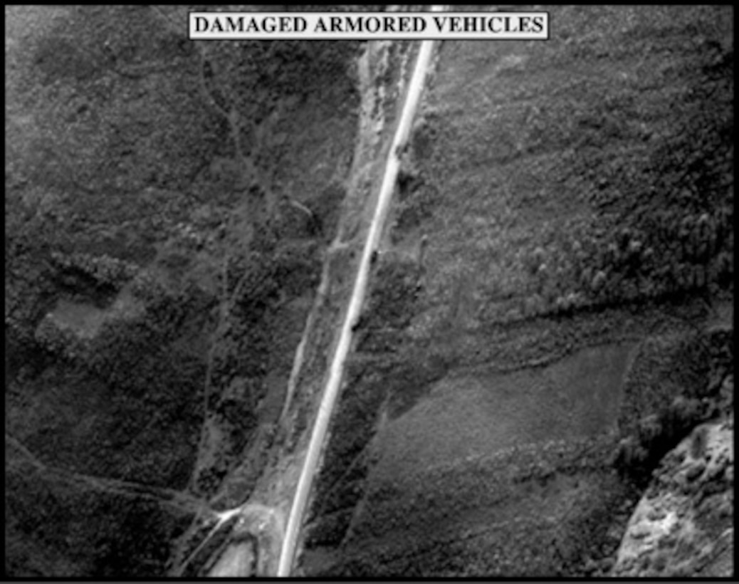 Post-strike bomb damage assessment photograph of Damaged Armored Vehicles used by Joint Staff Vice Director for Strategic Plans and Policy Maj. Gen. Charles F. Wald, U.S. Air Force, during a press briefing on NATO Operation Allied Force in the Pentagon on May 6, 1999. 