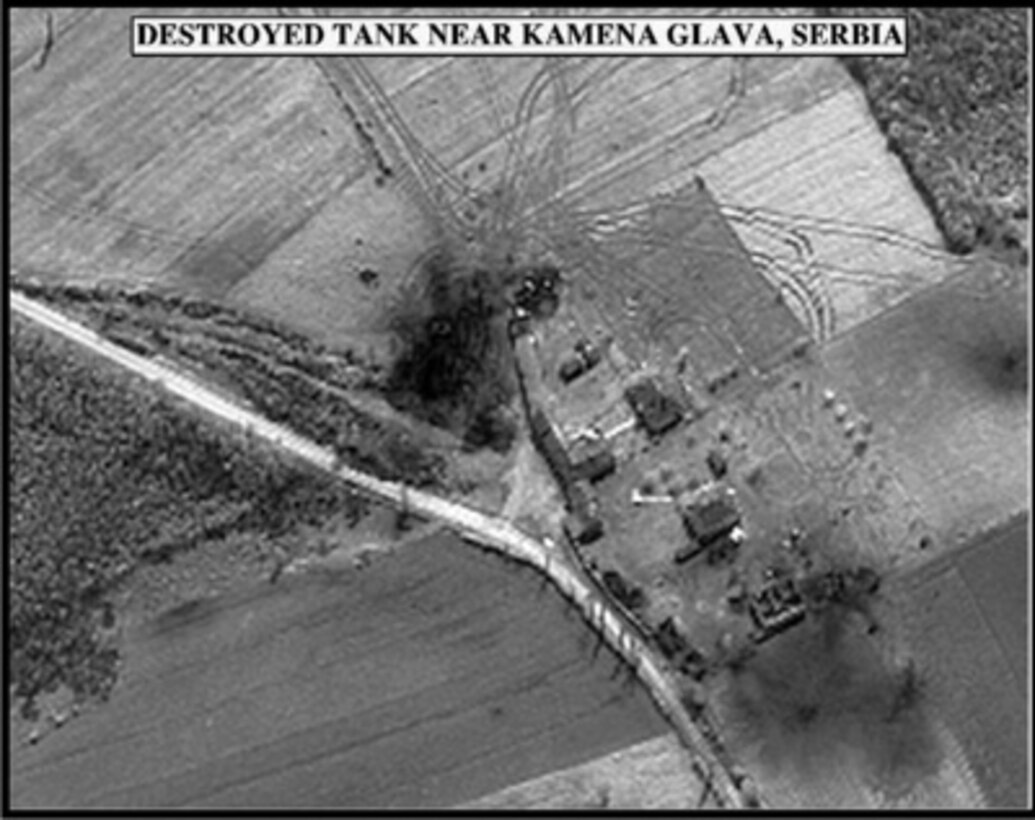 Post-strike bomb damage assessment photograph of a Destroyed Tank near Kamena Glava, Serbia, used by Joint Staff Vice Director for Strategic Plans and Policy Maj. Gen. Charles F. Wald, U.S. Air Force, during a press briefing on NATO Operation Allied Force in the Pentagon on May 6, 1999. 