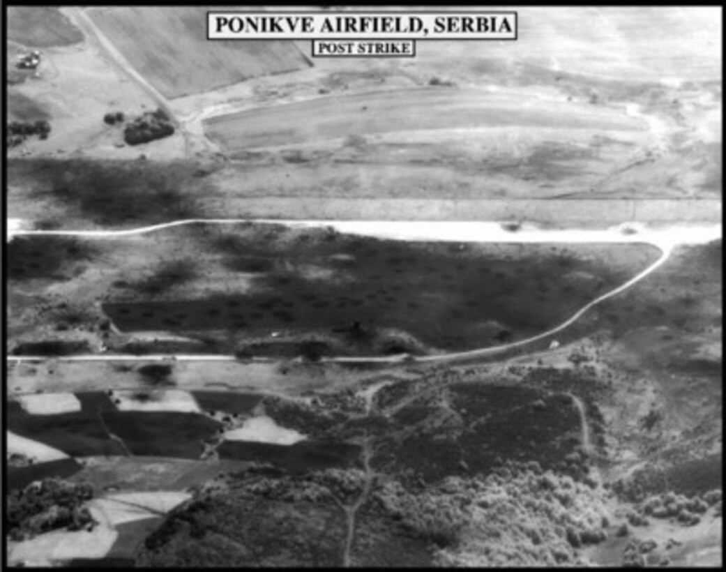 Post-strike bomb damage assessment photograph of the Ponikve Airfield, Serbia, used by Joint Staff Vice Director for Strategic Plans and Policy Maj. Gen. Charles F. Wald, U.S. Air Force, during a press briefing on NATO Operation Allied Force in the Pentagon on May 19, 1999. 