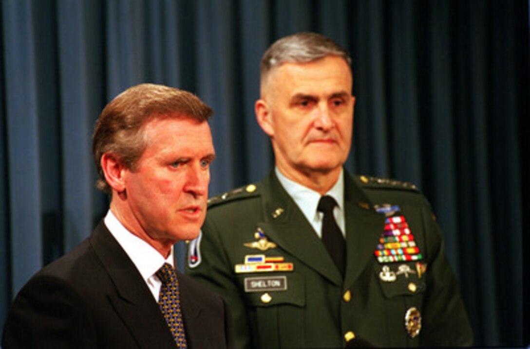 Secretary of Defense William S. Cohen (left) responds to a reporter's question during a Pentagon press briefing with Chairman of the Joint Chiefs of Staff Gen. Henry H. Shelton (right), U.S. Army, on NATO Operation Allied Force, on May 12, 1999. 