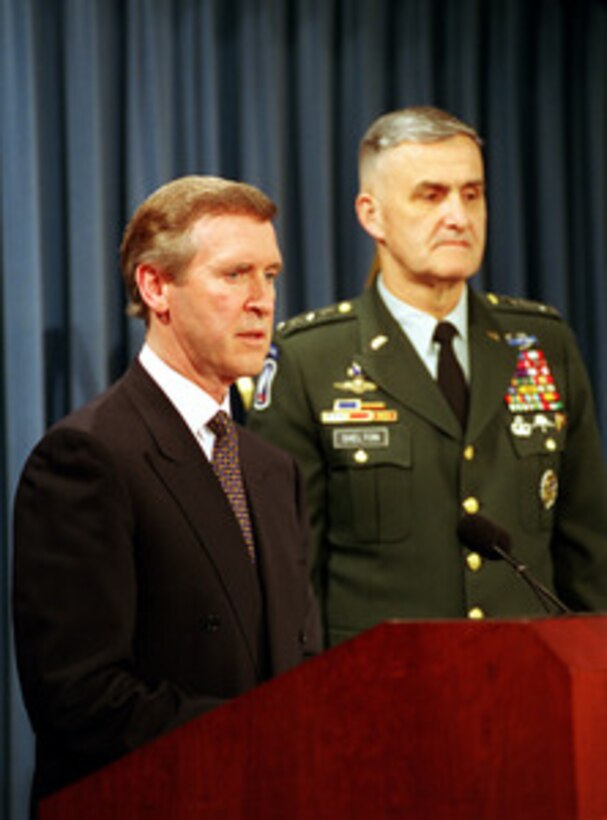 Secretary of Defense William S. Cohen (left) responds to a reporter's question during a Pentagon press briefing with Chairman of the Joint Chiefs of Staff Gen. Henry H. Shelton (right), U.S. Army, on NATO Operation Allied Force, on May 12, 1999. 