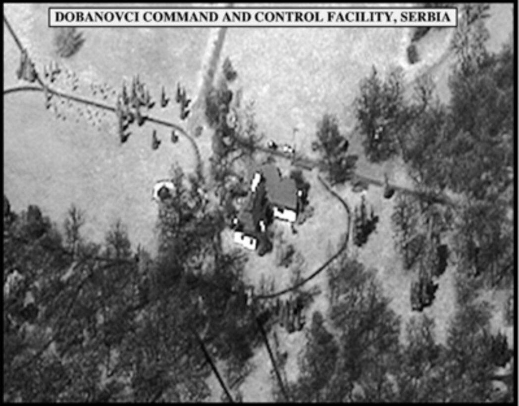 Post-strike bomb damage assessment photograph of the Dobanovci Command and Control Facility, Serbia, used by Joint Staff Vice Director for Strategic Plans and Policy Maj. Gen. Charles F. Wald, U.S. Air Force, during a press briefing on NATO Operation Allied Force in the Pentagon on May 25, 1999. 
