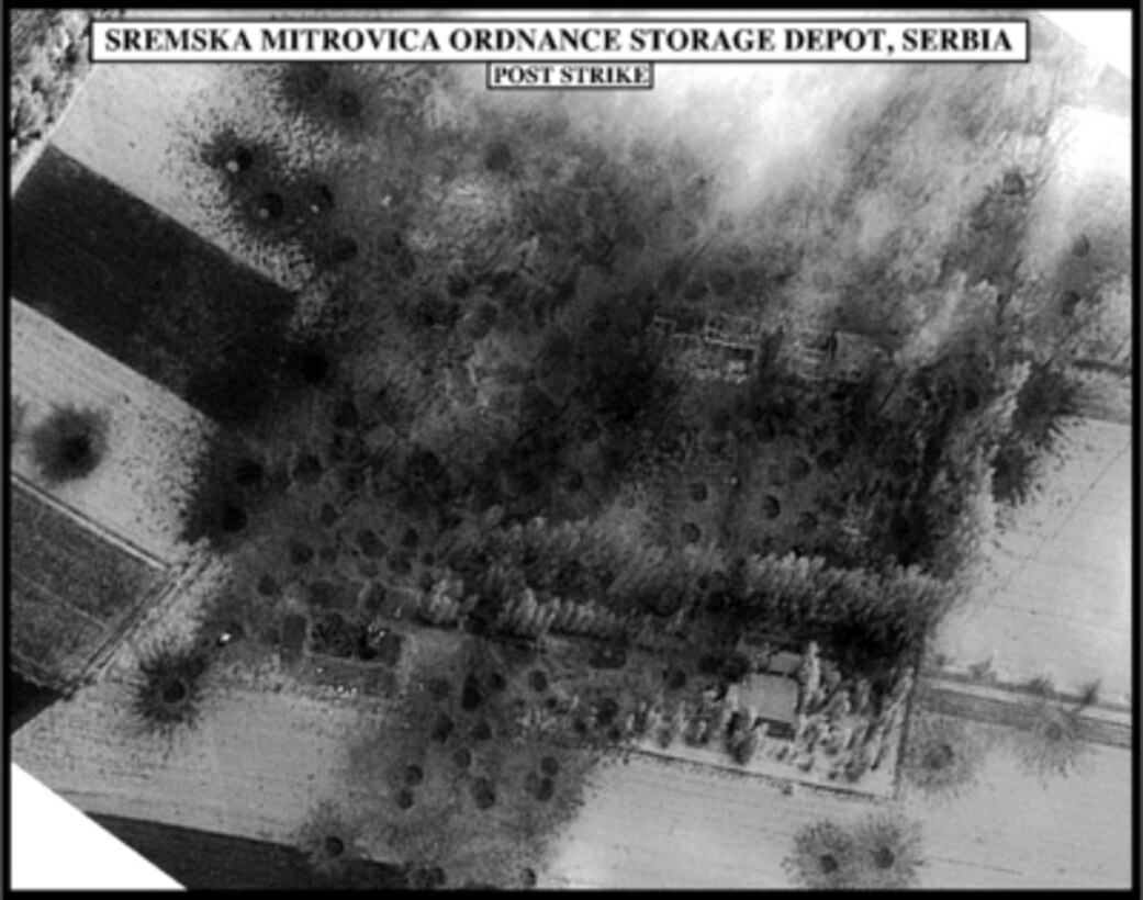 Post-strike bomb damage assessment photograph of the Sremska Mitrovica Ordnance Storage Depot, Serbia, used by Joint Staff Vice Director for Strategic Plans and Policy Maj. Gen. Charles F. Wald, U.S. Air Force, during a press briefing on NATO Operation Allied Force in the Pentagon on May 26, 1999. 