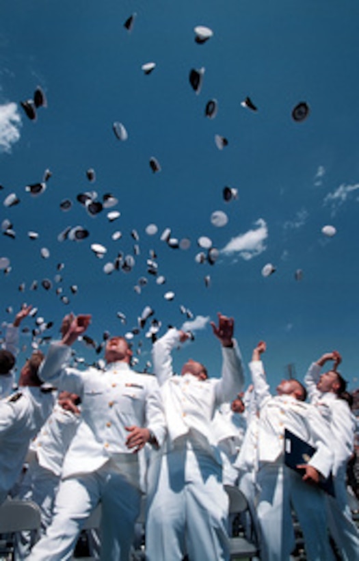 Jubilant graduates of the United States Naval Academy Class of 1999 keep the "hat toss" tradition alive, marking an end to their graduation and commissioning ceremonies on May 26, 1999, in Annapolis Md. The hat toss tradition originated at the Naval Academy in 1912. Before then, academy graduates were required to serve two years in the fleet as midshipmen before being commissioned as officers in the Navy; thus they had a need for their midshipman hats. The Class of 1912, commissioned at graduation, was issued officer caps, and in a spontaneous gesture, tossed the midshipmen hats into the air. This hat toss has since become the symbolic end to the four-year program at Annapolis. 