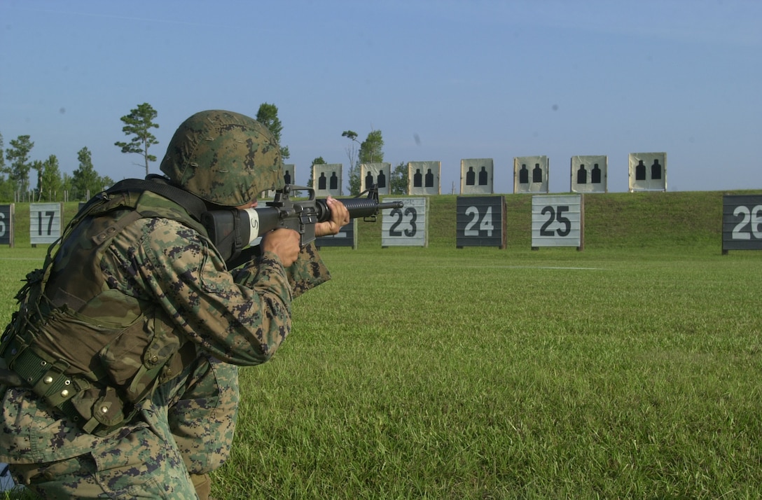 MARINE CORPS BASE CAMP LEJEUNE, N.C. - Cpl. Dennis Bagley, a platoon sergeant with the Marine Corps Engineer School, fires the new field fire portion of the new rifle range course here Sept. 1. The annual rifle qualification for Marines will be a little different Nov. 1 here at Marine Corps Base. The rifle qualification is going to be split into two tables. The first table will be the entry-level course of fire, and the field fire has been replaced with a new course of fire designed shooting at close distances. (Official U.S. Marine Corps photo by Lance Cpl. Brandon R. Holgersen)