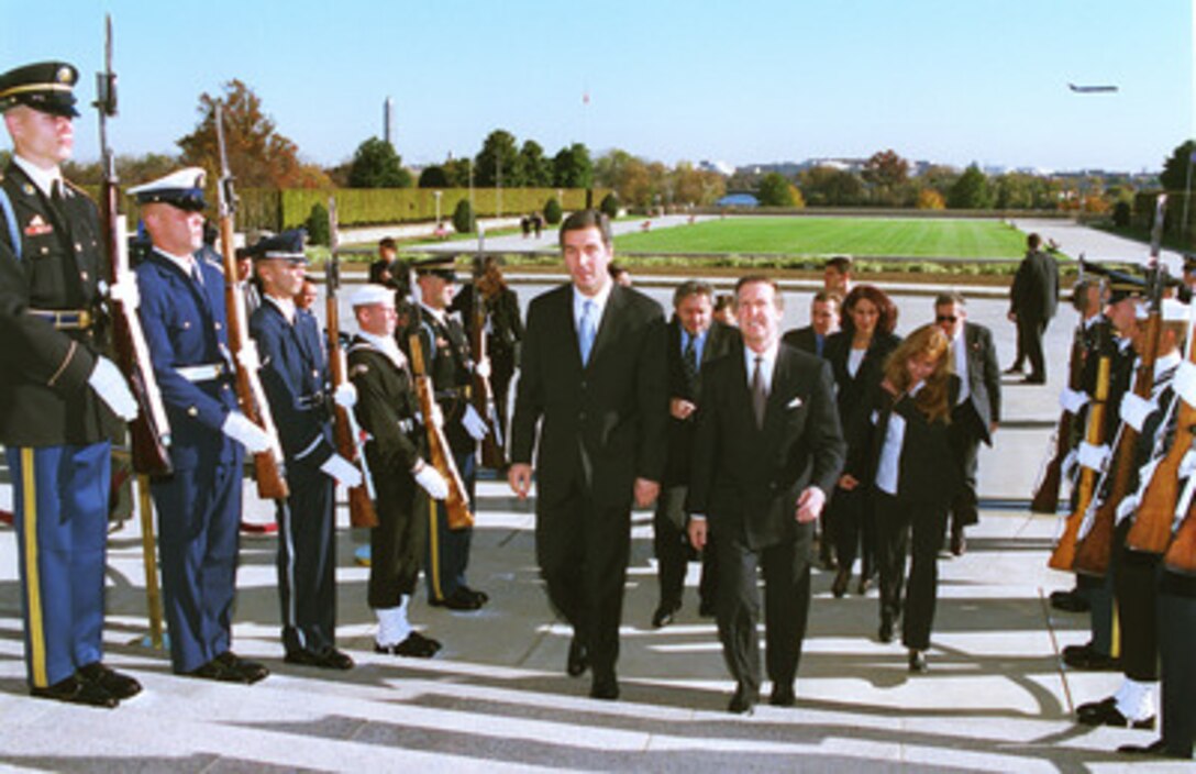 Secretary of Defense William Cohen (right) escorts President Milo Djukanovic, of Montenegro, into the Pentagon on Nov. 4, 1999. The two men will meet to discuss regional security issues in Montenegro, which is a state in the Federal Republic of Yugoslavia. 