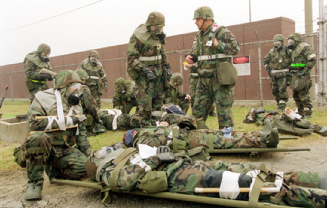 U.S. Air Force personnel from the 51st Maintenance Squadron conduct a mass casualty exercise near the flight line at Osan Air Base, Korea, as part of Exercise Foal Eagle '99 on Oct. 27, 1999. Exercise Foal Eagle '99 is the 38th in a series of regularly scheduled rear area defense field training exercises. The annual exercise is held at a variety of locations throughout the Korean peninsula and involves some 30,000 U.S. military forces. 