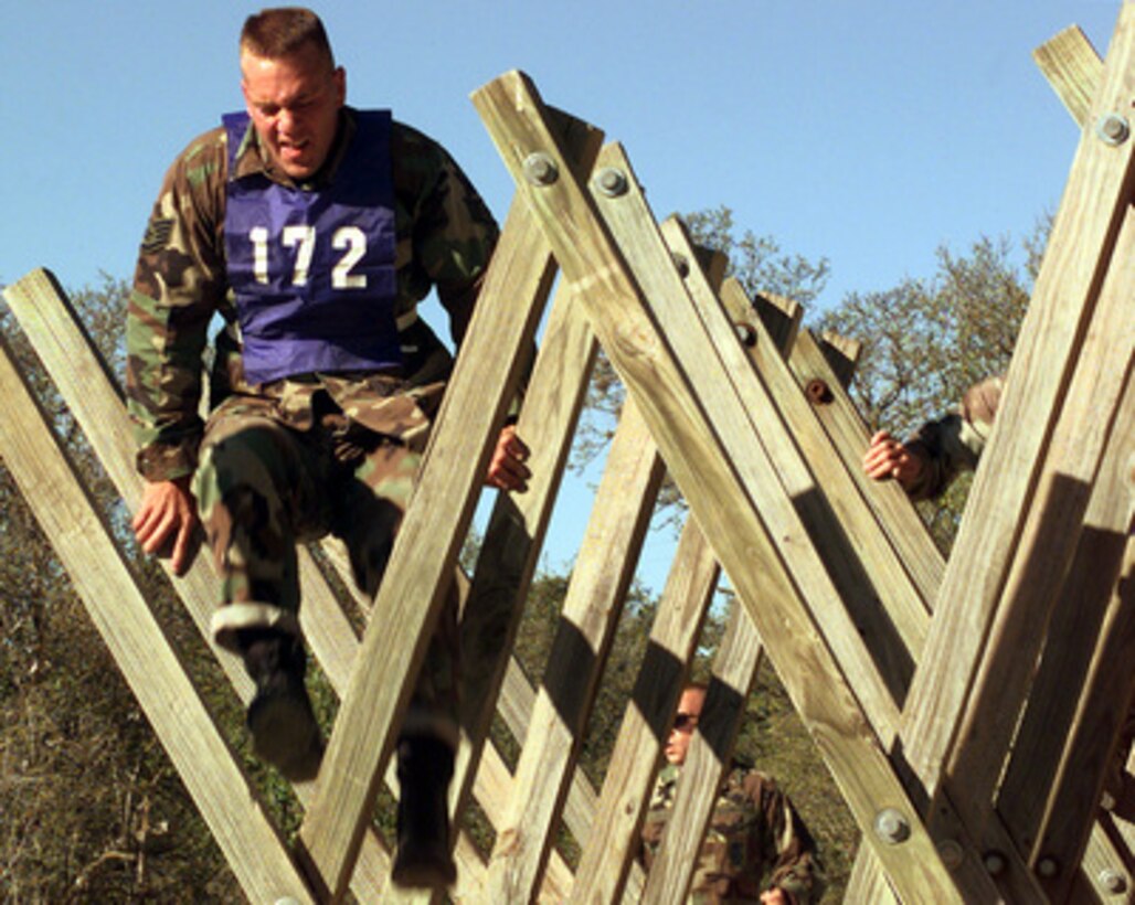 Staff Sgt. John Borowski steps to the last hurdle of the Tough Nut obstacle during Defender Challenge '99 at Lackland Air Force Base, Texas, on Nov. 1, 1999. Defender Challenge is an all-star competition featuring Security Forces from Air Force major commands and the Royal Air Force Regiment. Teams compete in a fitness challenge, handgun events, combat rifle, combat weapons and nighttime tactical events. Borowski is a member of the Pacific Air Forces team. 
