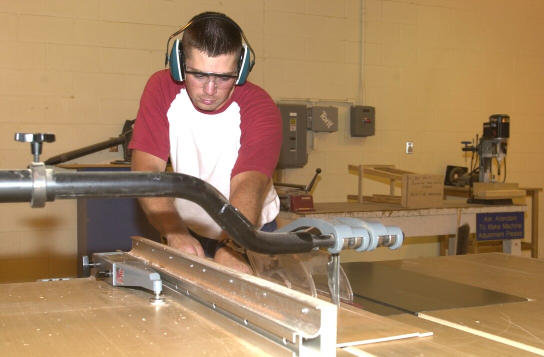 MARINE CORPS BASE CAMP LEJEUNE, N.C. - Staff Sgt. James Allen, a combat instructor with the School of Infantry (East), cuts a piece of wood at the Wood Hobby Shop here Aug. 20. The Wood Hobby Shop here offers service members and family a healthy and creative hobby aboard the base. (Official U.S. Marine Corps photo by Lance Cpl. Brandon R. Holgersen)